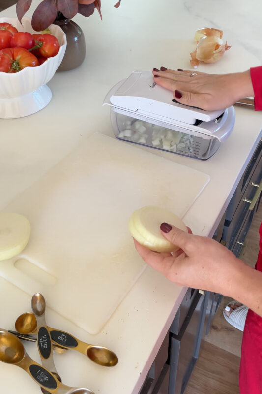 Using a chopper for dicing my onions for this blue ribbon chili recipe.